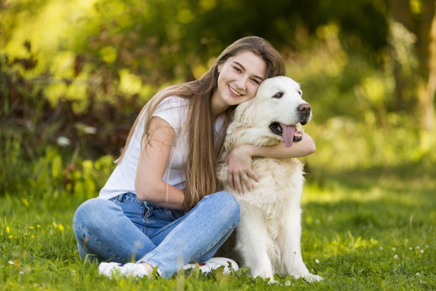 young woman hugging her dog 23 2148650405 - Fostering Saves Lives